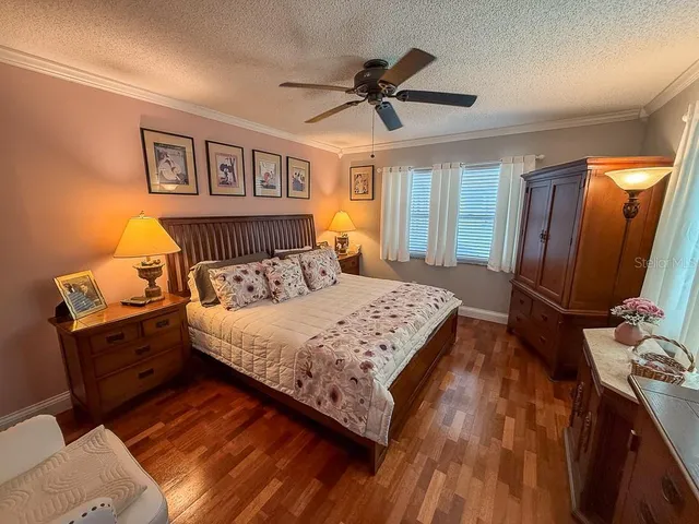 a bathroom with a granite countertop sink mirror vanity and toilet