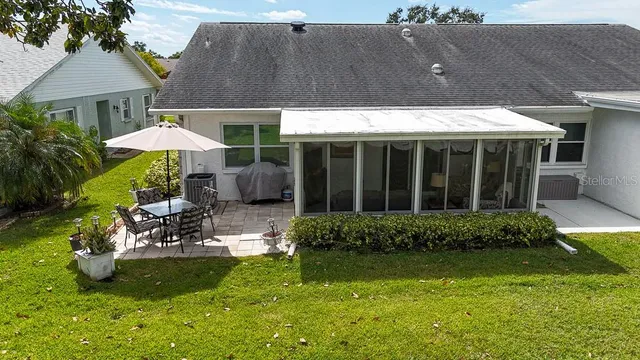 a view of outdoor space with garden and trees