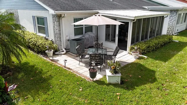 a view of a park with plants and trees