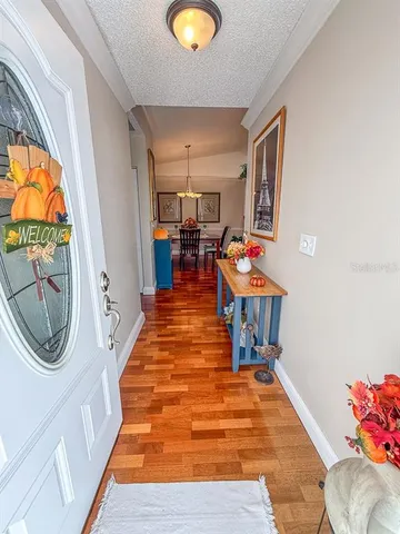 a kitchen with stainless steel appliances granite countertop a sink refrigerator and cabinets