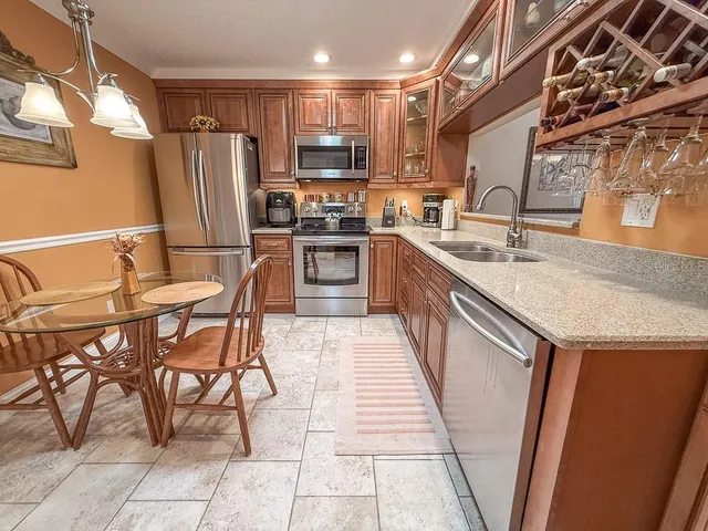 a kitchen with a refrigerator stove and microwave
