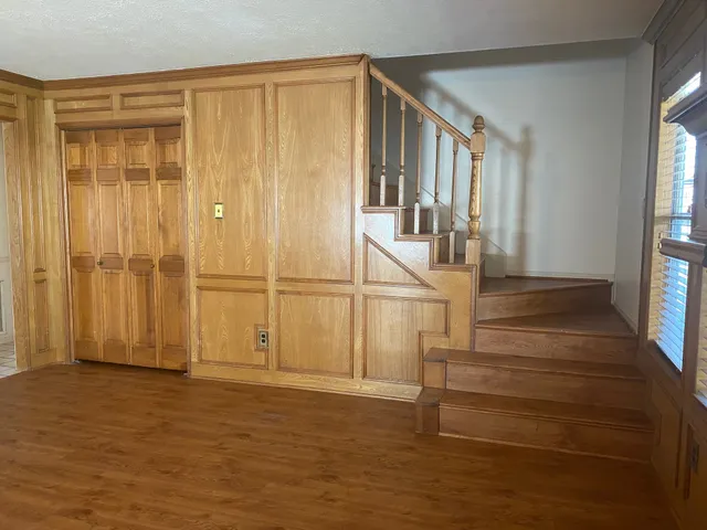 a view of entryway with wooden floor