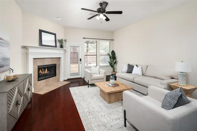 a living room with furniture and a fireplace