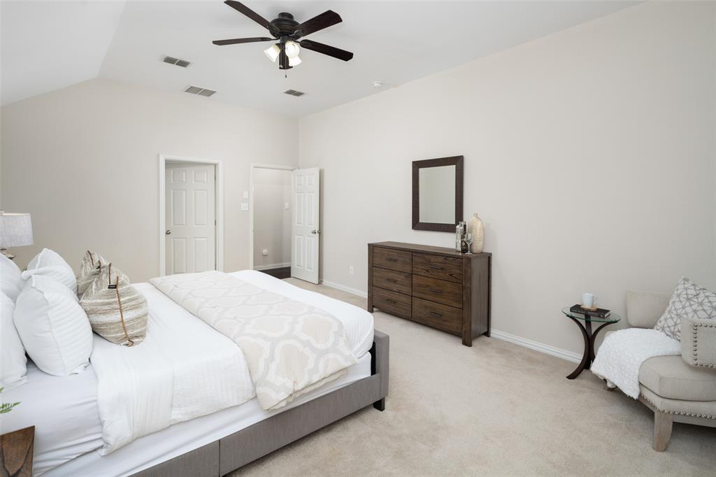 7518 Forest Ridge Trail Sachse, TX 75048 - Photo 19 of 40 a bedroom with a bed and a dresser