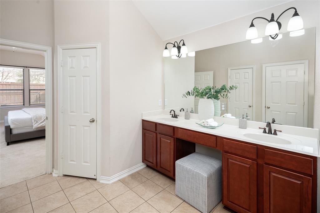 7518 Forest Ridge Trail Sachse, TX 75048 - Photo 21 of 40 a en suite bathroom with a double vanity sink and a mirror