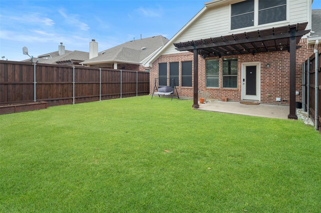 7518 Forest Ridge Trail Sachse, TX 75048 - Photo 28 of 40 a view of a house with a backyard
