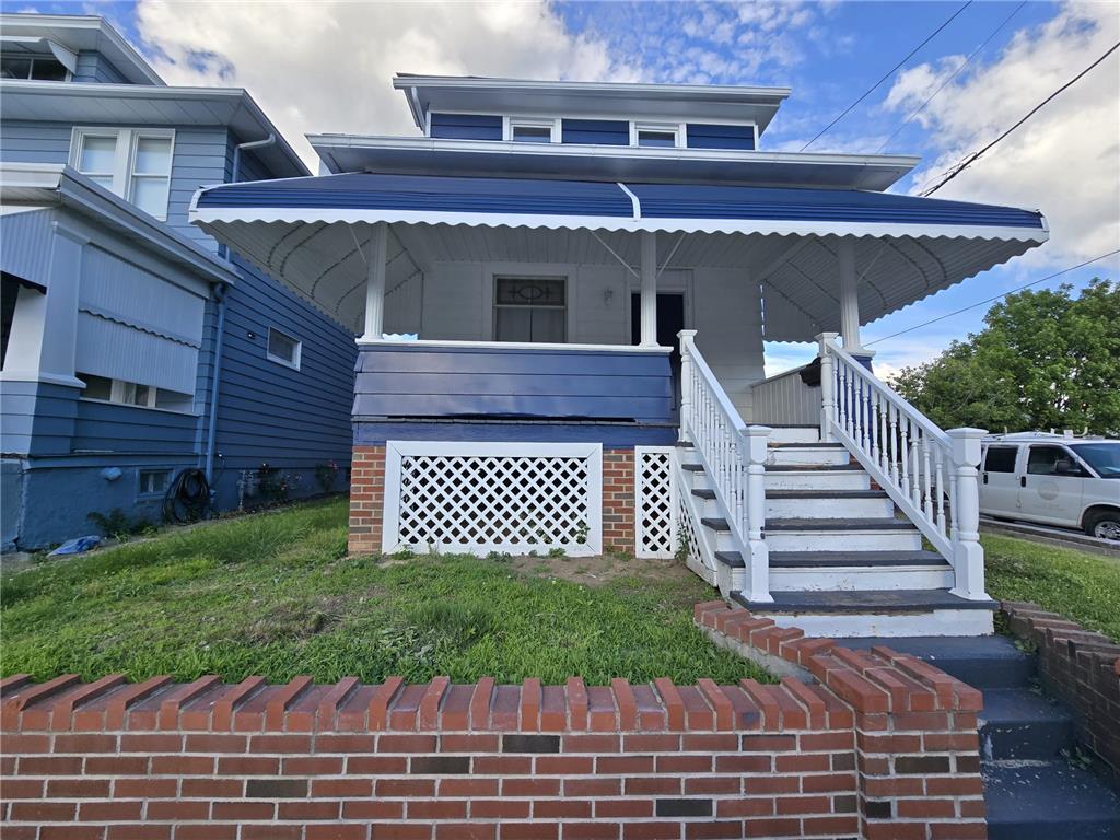 883 North Locust Street Hazleton, PA 18201 - Photo 6 of 83 A charming blue residence with a welcoming covered front porch and classic white railings invites you home.