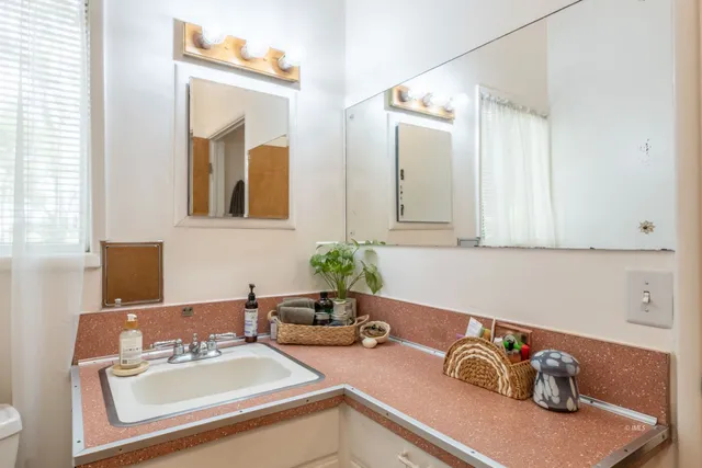 a bathroom with a sink and a mirror