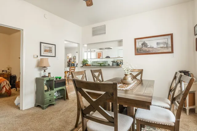 a dining room with furniture and window