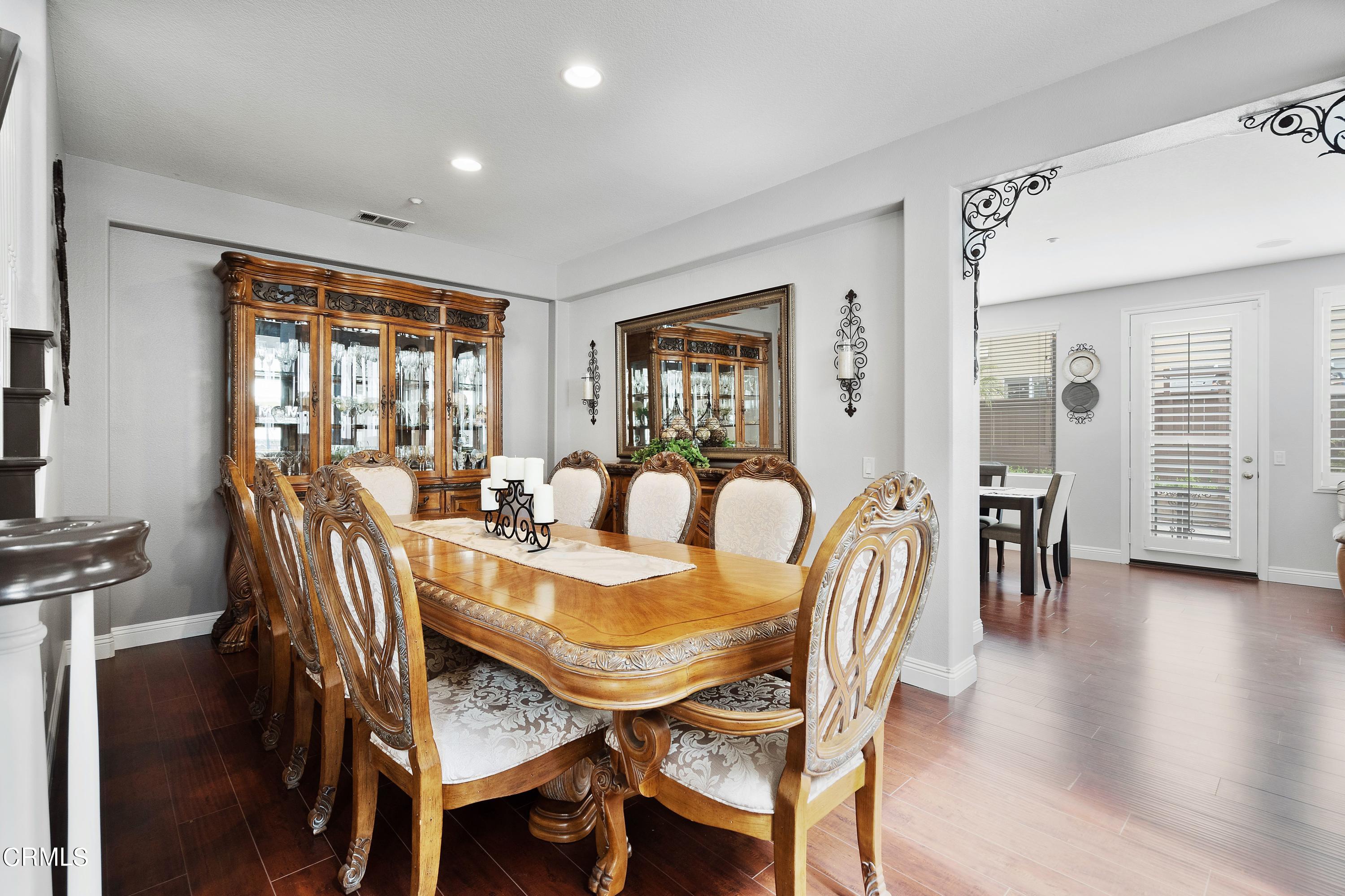 1713 Tiesa Lane Oxnard, CA 93030 - Photo 12 of 48 a view of a dining room with furniture window and wooden floor