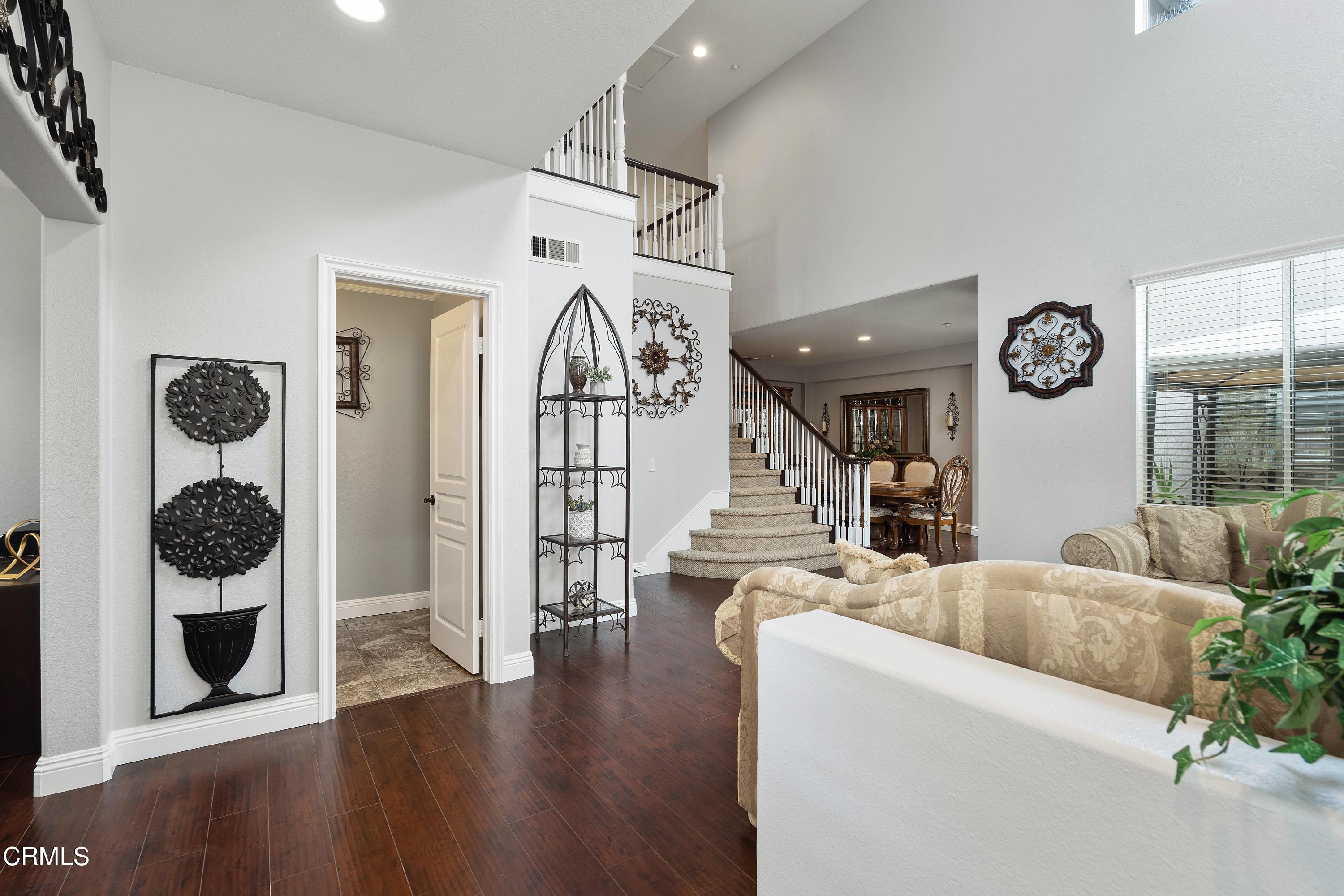 1713 Tiesa Lane Oxnard, CA 93030 - Photo 17 of 48 a living room with fireplace furniture and a wooden floor