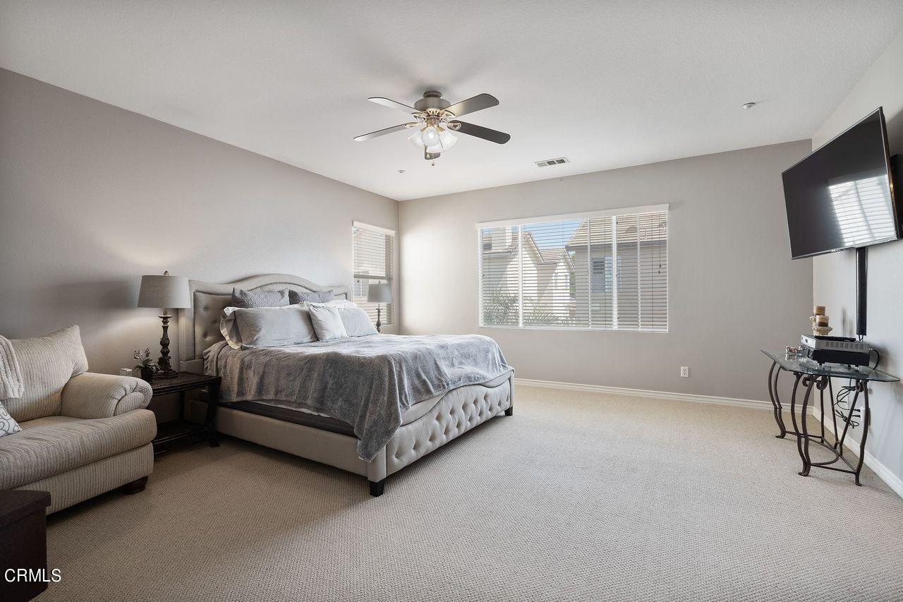 1713 Tiesa Lane Oxnard, CA 93030 - Photo 18 of 48 a bedroom with a bed a mirror on dresser and a window