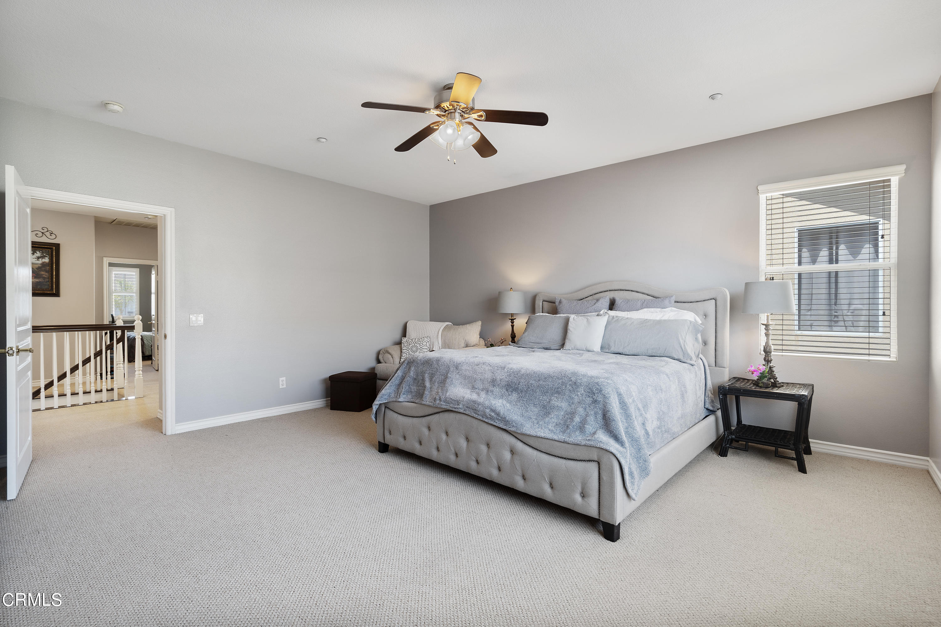 1713 Tiesa Lane Oxnard, CA 93030 - Photo 19 of 48 a spacious bedroom with a bed and a table in it