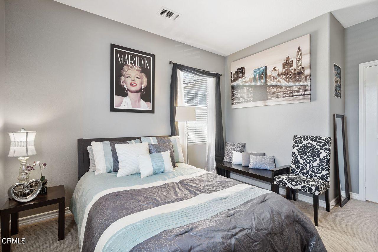 1713 Tiesa Lane Oxnard, CA 93030 - Photo 26 of 48 a bedroom with bed and wall painting