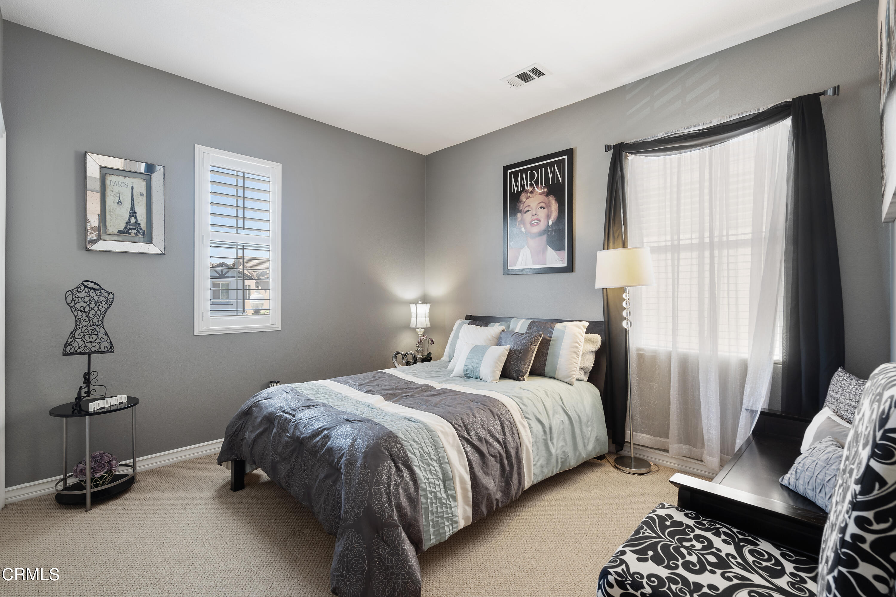 1713 Tiesa Lane Oxnard, CA 93030 - Photo 27 of 48 a bedroom with a bed and wooden floor