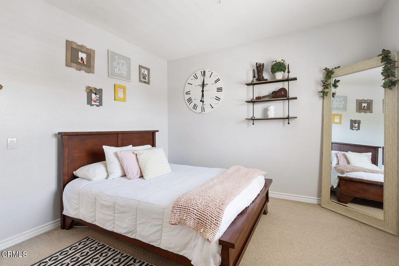 1713 Tiesa Lane Oxnard, CA 93030 - Photo 31 of 48 a bedroom with a bed and painting on the wall