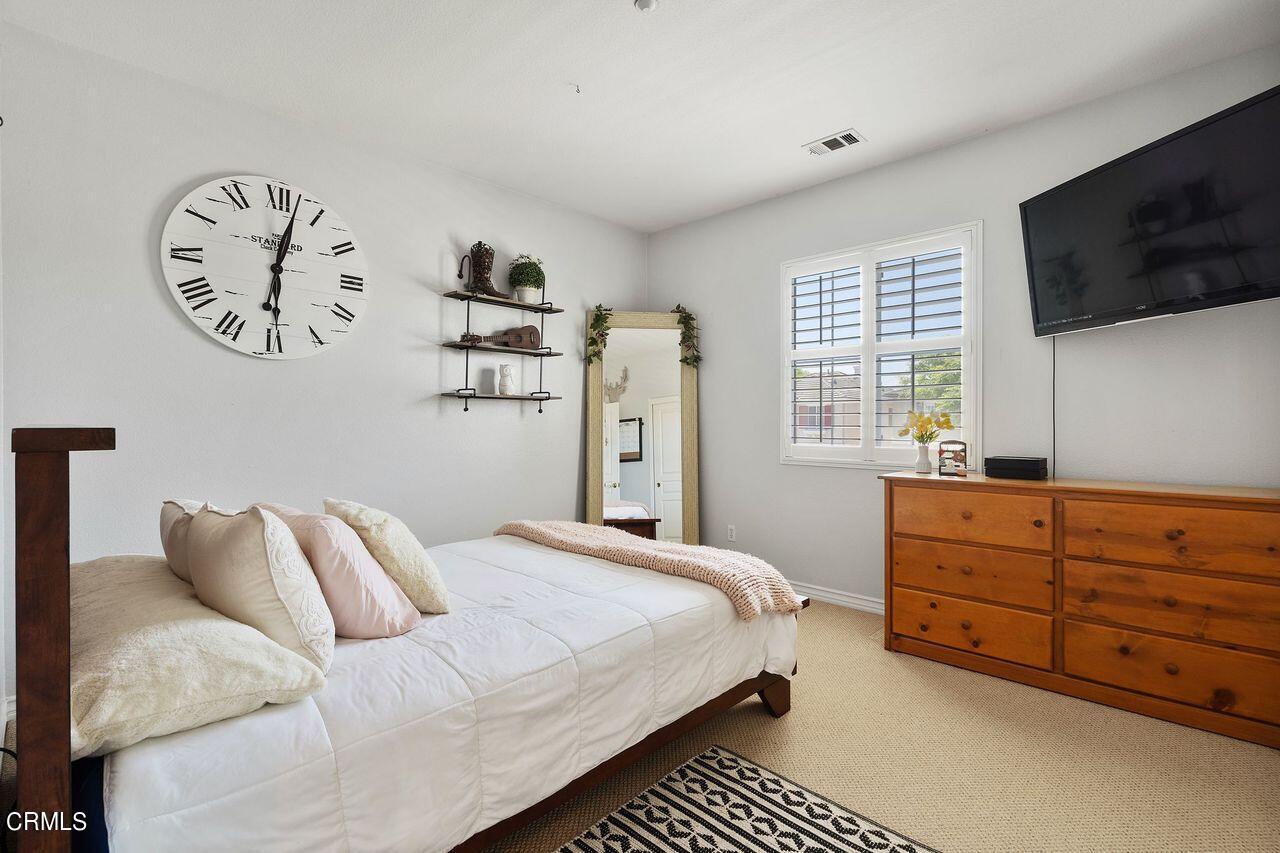 1713 Tiesa Lane Oxnard, CA 93030 - Photo 33 of 48 a bedroom with a bed and a flat screen tv