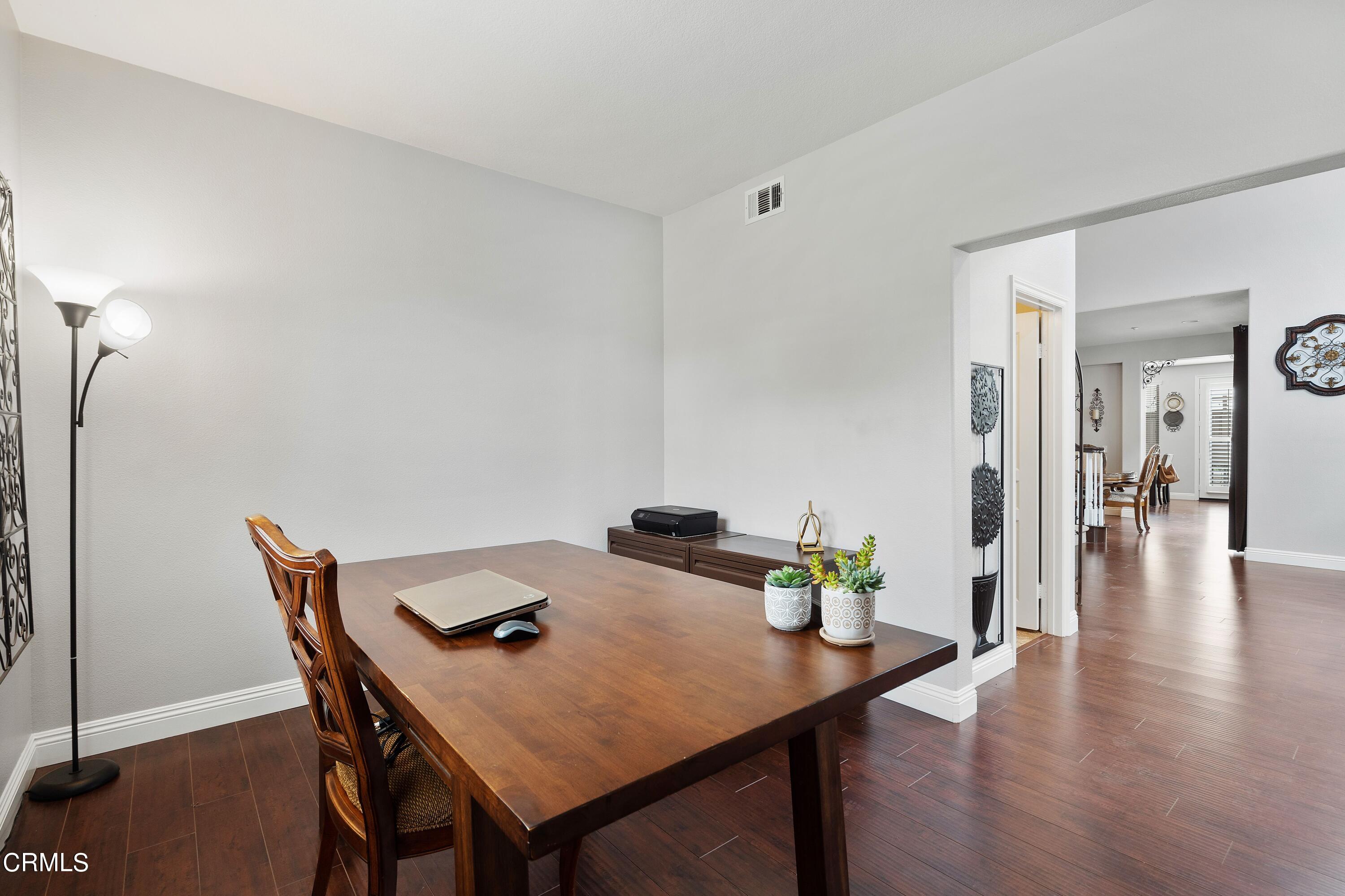 1713 Tiesa Lane Oxnard, CA 93030 - Photo 41 of 48 a view of a dining room with furniture and wooden floor