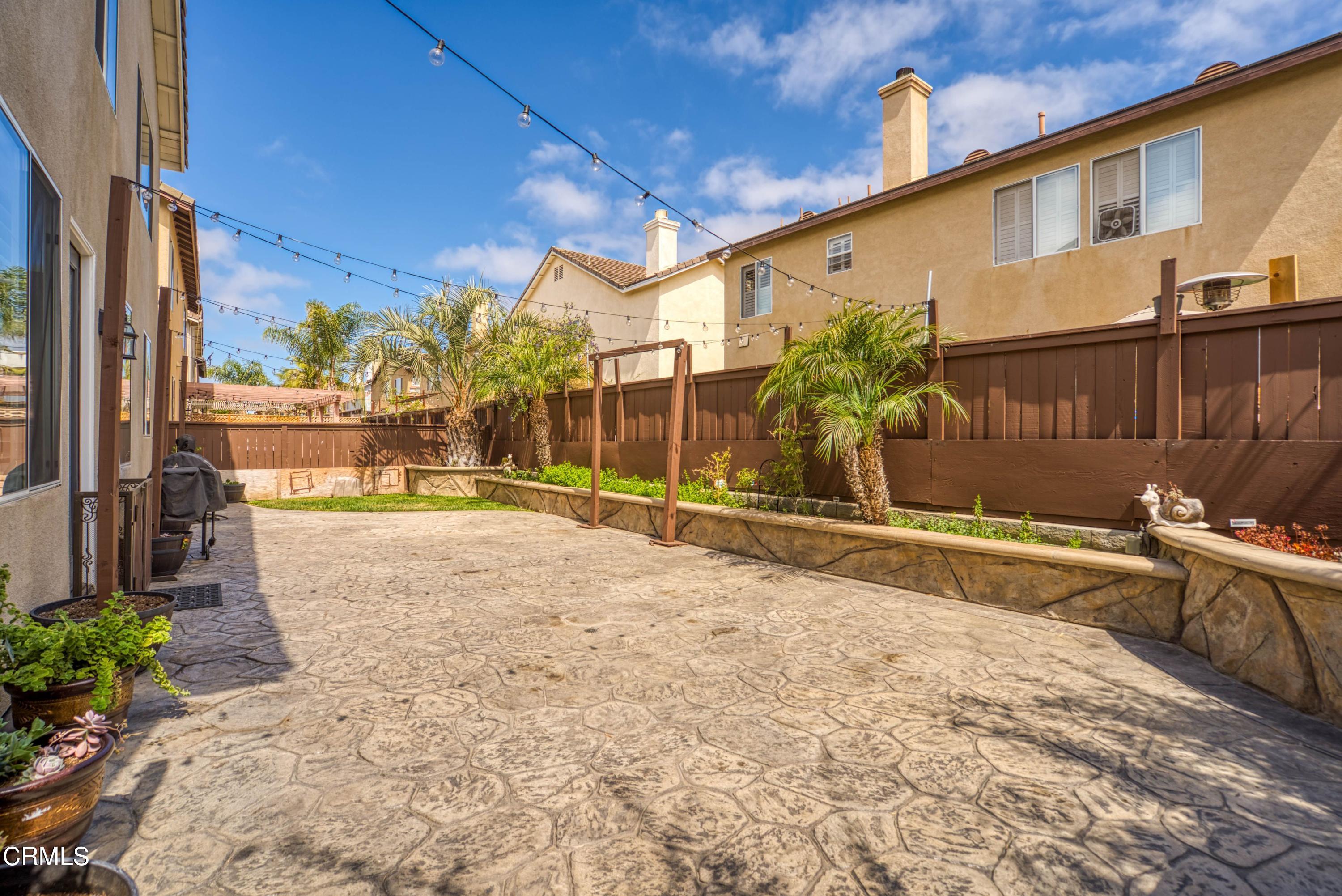 1713 Tiesa Lane Oxnard, CA 93030 - Photo 45 of 48 a view of a house with a backyard