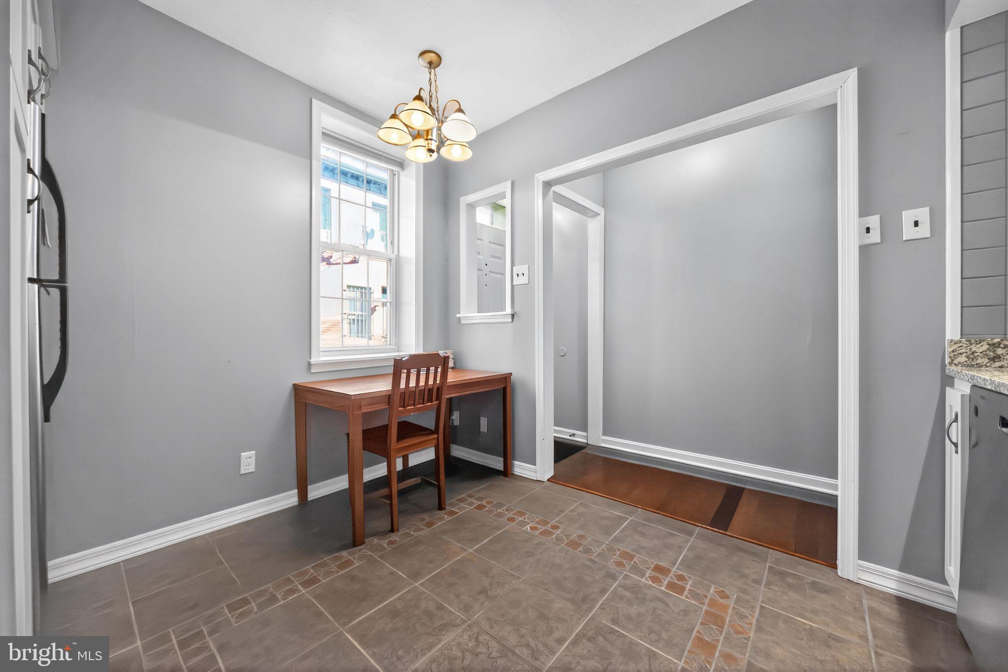 1704 Webster Street Philadelphia, PA 19146 - Photo 12 of 20 a view of a workspace with furniture and a window