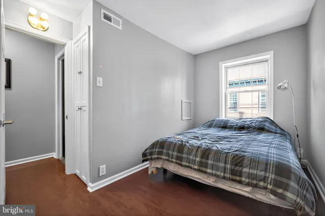 a bathroom with a sink a toilet a mirror and shower