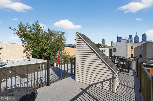 a view of balcony with seating space and hardwood floor