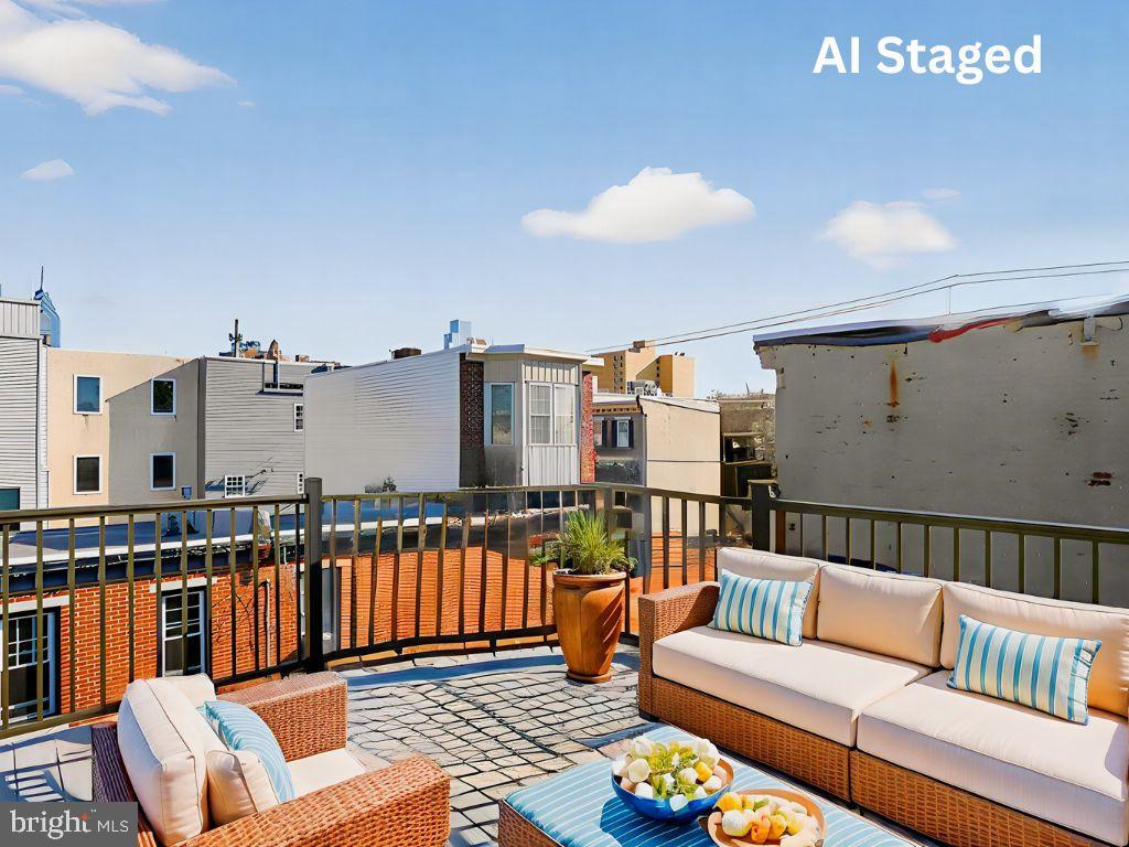 1704 Webster Street Philadelphia, PA 19146 - Photo 2 of 20 a roof deck with couches and potted plants with wooden floor