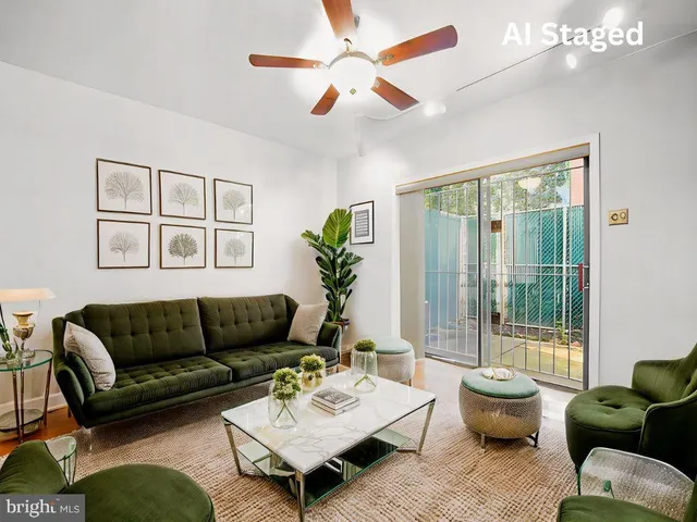 a bedroom with a bed and a potted plant