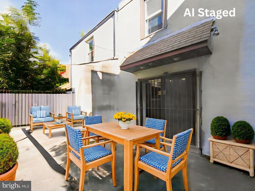 1704 Webster Street Philadelphia, PA 19146 - Photo 7 of 20 a view of a patio with table and chairs and potted plants