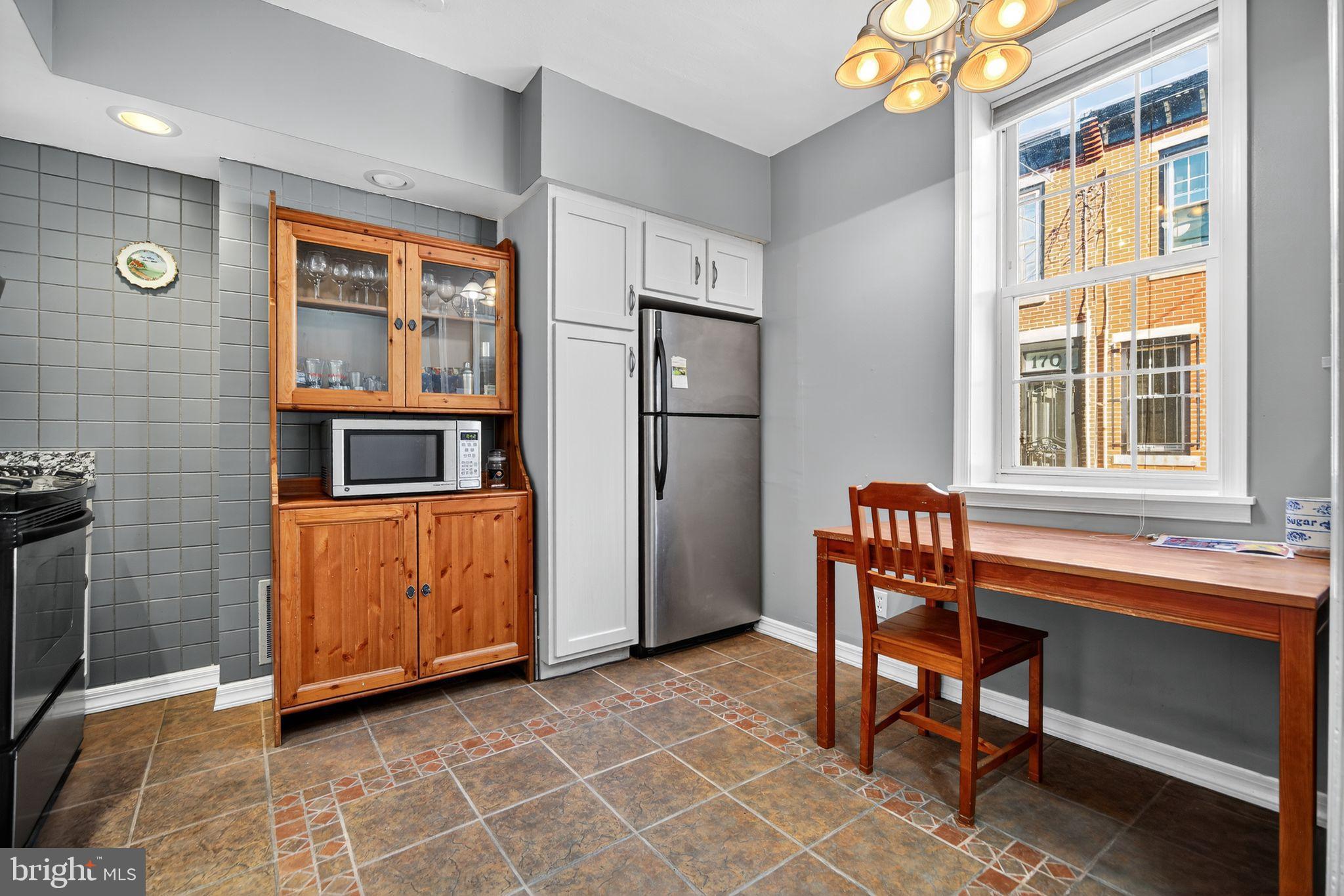 1704 Webster Street Philadelphia, PA 19146 - Photo 10 of 20 a kitchen with stainless steel appliances granite countertop a refrigerator and a sink