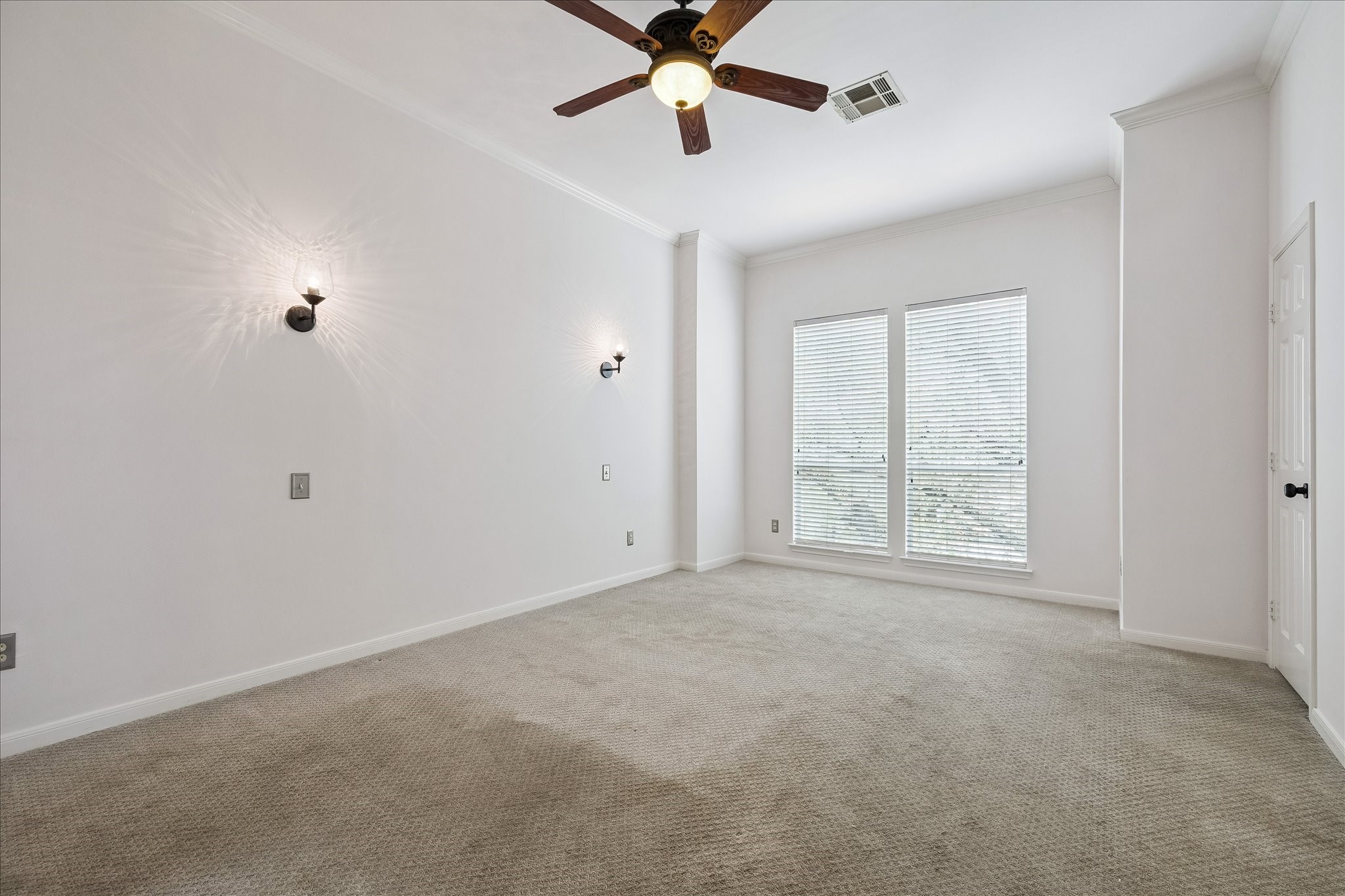 3001 Austin Street Houston, TX 77004 - Photo 12 of 26 The primary suite boasts wall sconces, large windows for great natural light and ample space.