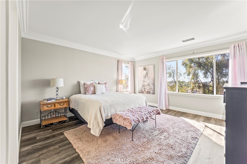51 Rolling Ridge Rancho Santa Margarita, CA 92688 - Photo 22 of 61 a bed room with a bed and a large window