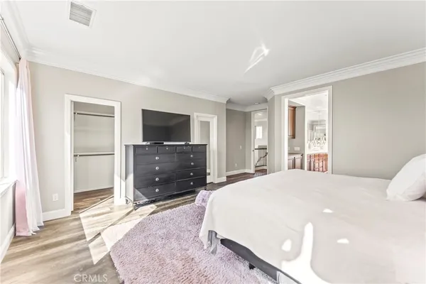 a bedroom with a bed and a desk