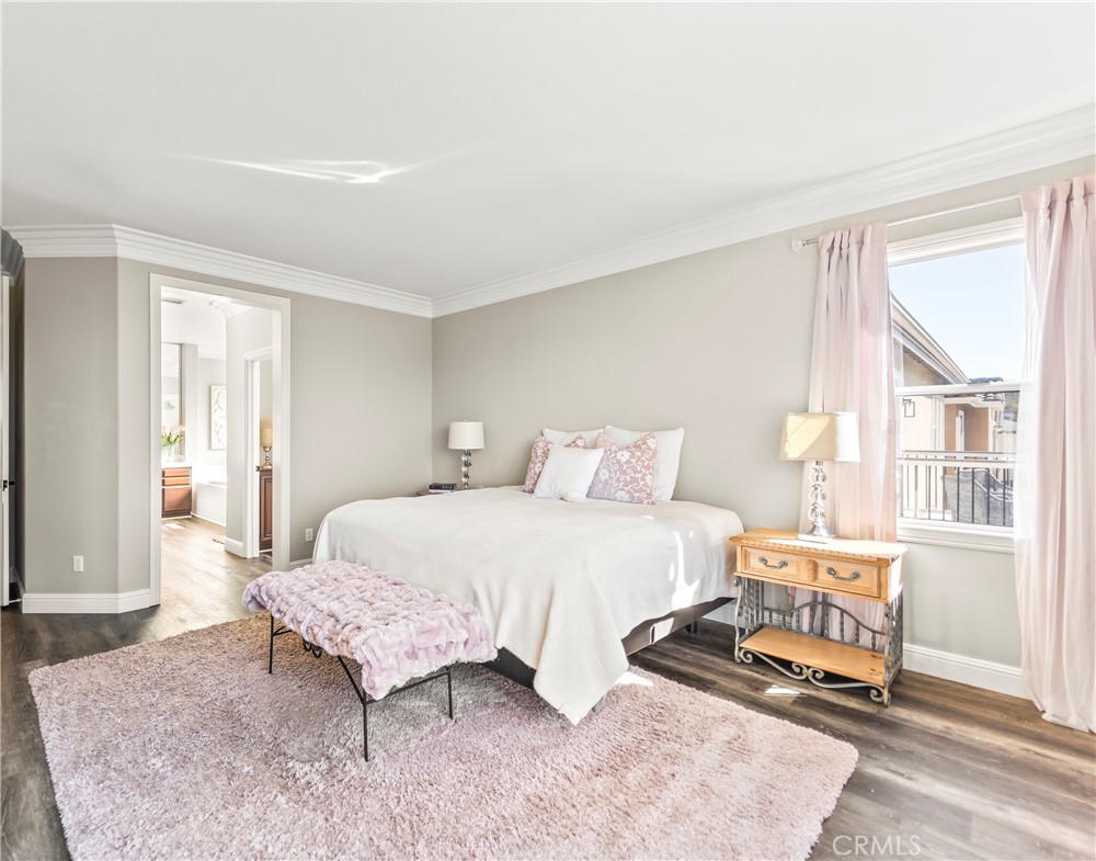 51 Rolling Ridge Rancho Santa Margarita, CA 92688 - Photo 24 of 61 a bedroom with a bed and wooden floor