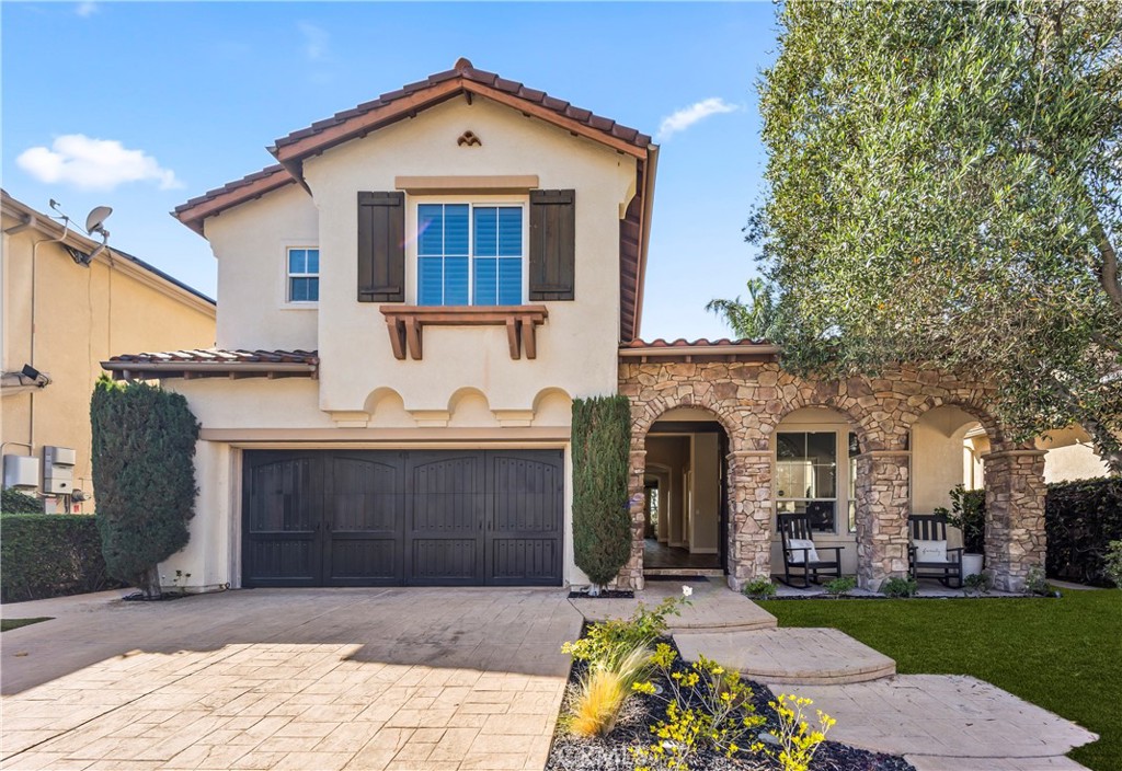 51 Rolling Ridge Rancho Santa Margarita, CA 92688 - Photo 3 of 61 a front view of a house with a yard and garage