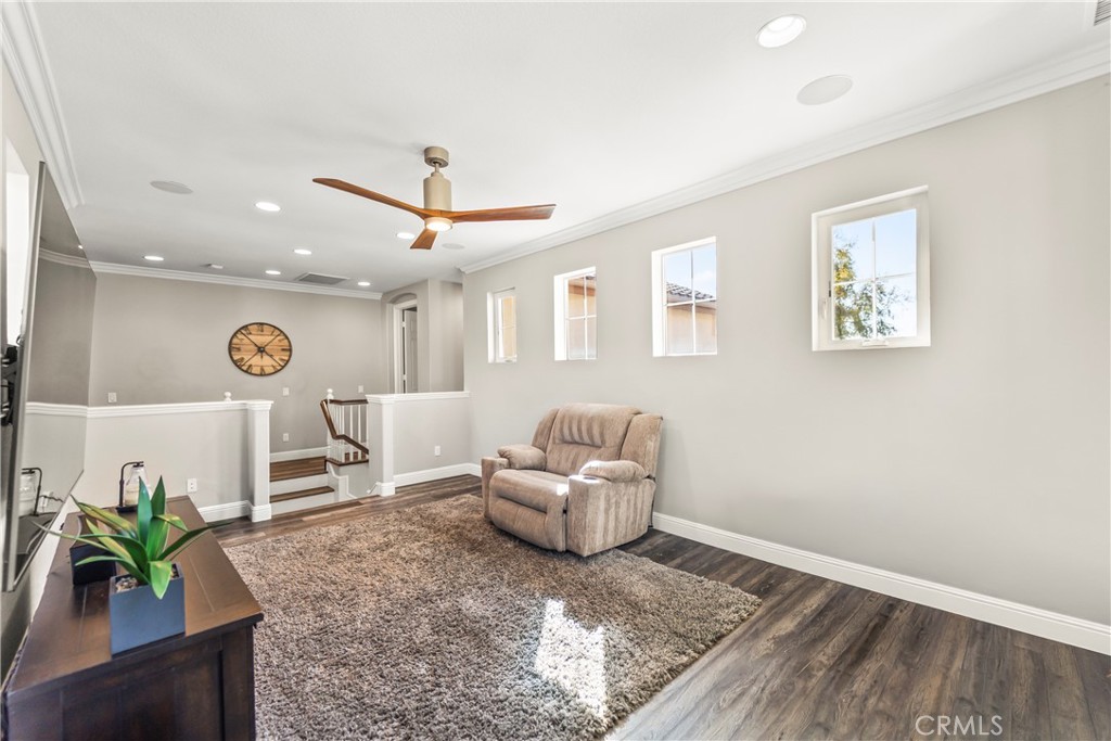 51 Rolling Ridge Rancho Santa Margarita, CA 92688 - Photo 33 of 61 a living room with furniture and a potted plant
