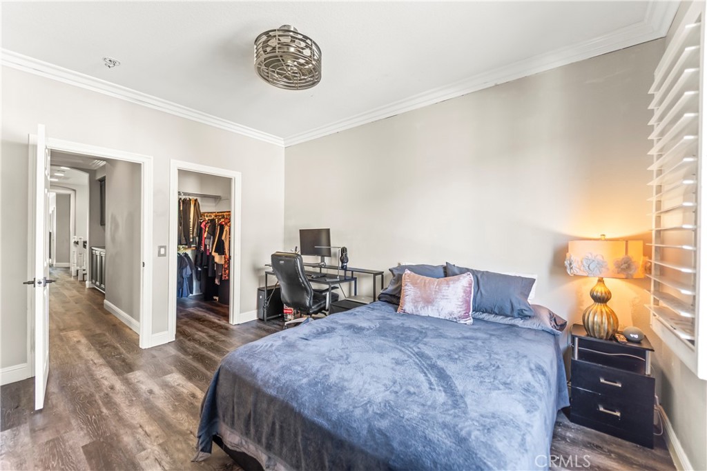 51 Rolling Ridge Rancho Santa Margarita, CA 92688 - Photo 39 of 61 a bedroom with a bed and wooden floor