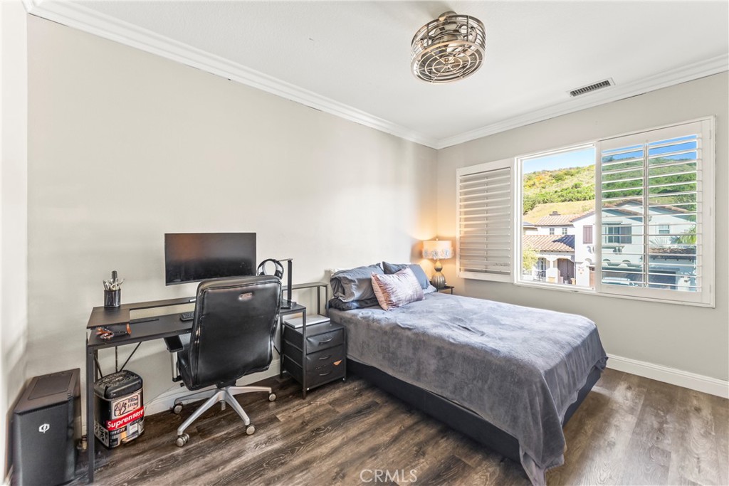 51 Rolling Ridge Rancho Santa Margarita, CA 92688 - Photo 42 of 61 a bedroom with a bed and a desk