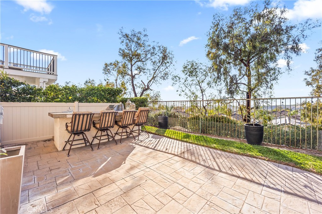 51 Rolling Ridge Rancho Santa Margarita, CA 92688 - Photo 46 of 61 a view of a lake with a bench next to a yard