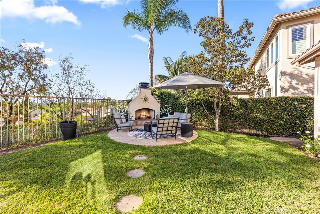 51 Rolling Ridge Rancho Santa Margarita, CA 92688 - Photo 49 of 61 Grassy area and paved sitting area near fireplace