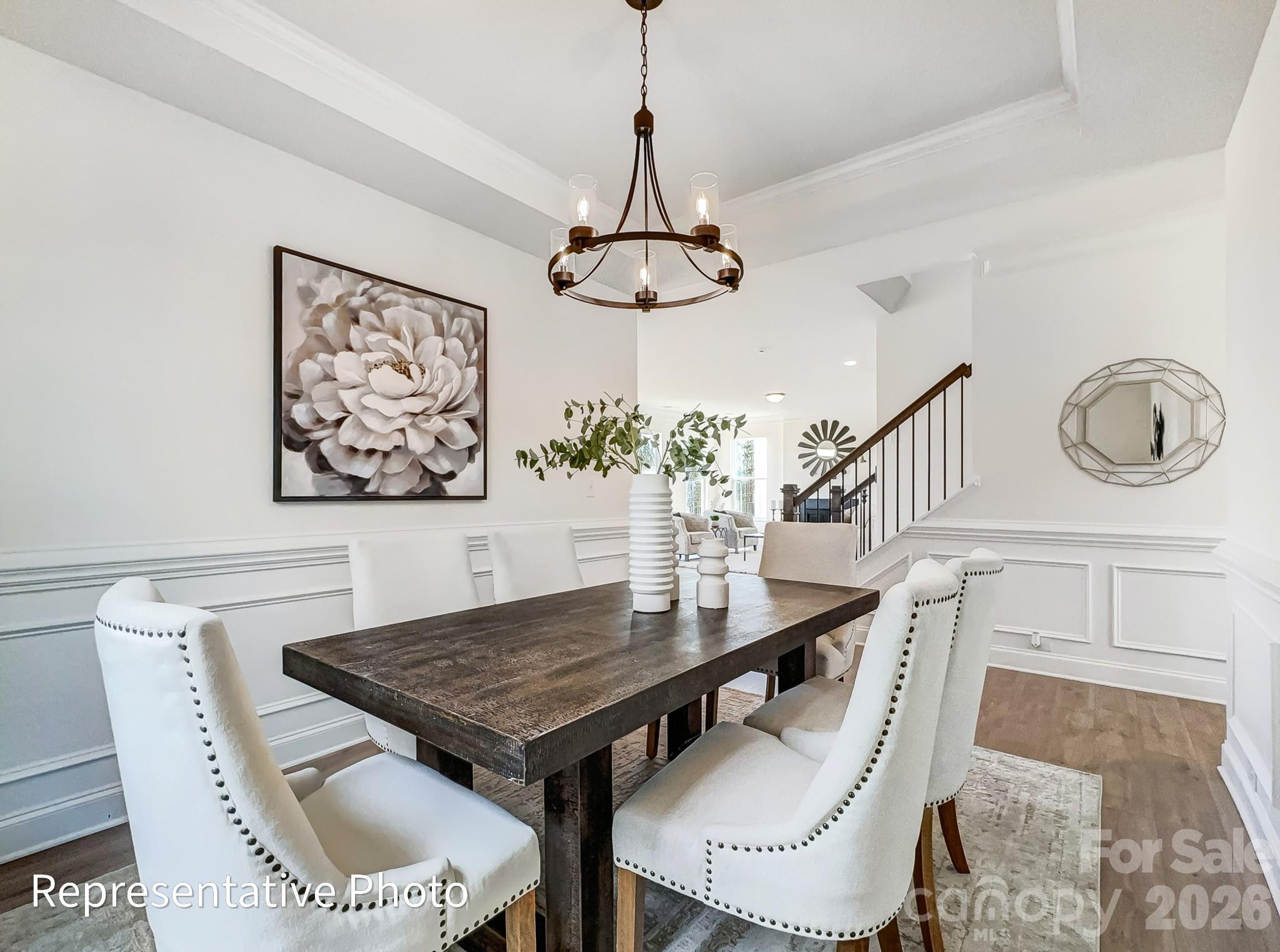 2608 Wild Azalea Court Monroe, NC 28110 - Photo 12 of 26 a view of a dining room with furniture window and wooden floor