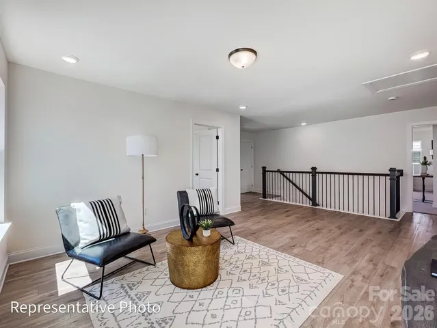 a dining room with furniture and a potted plant