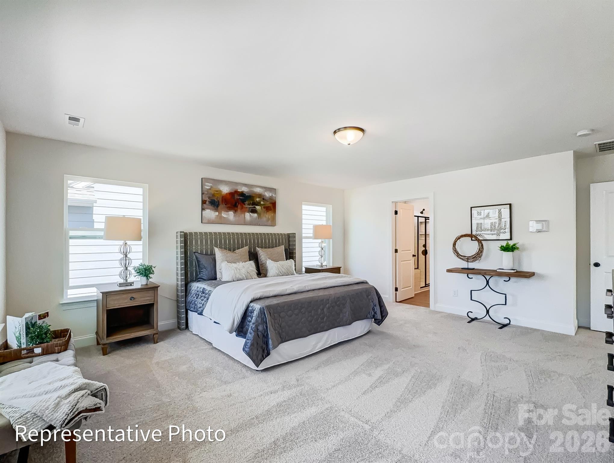 2608 Wild Azalea Court Monroe, NC 28110 - Photo 18 of 26 a spacious bedroom with a bed and a window