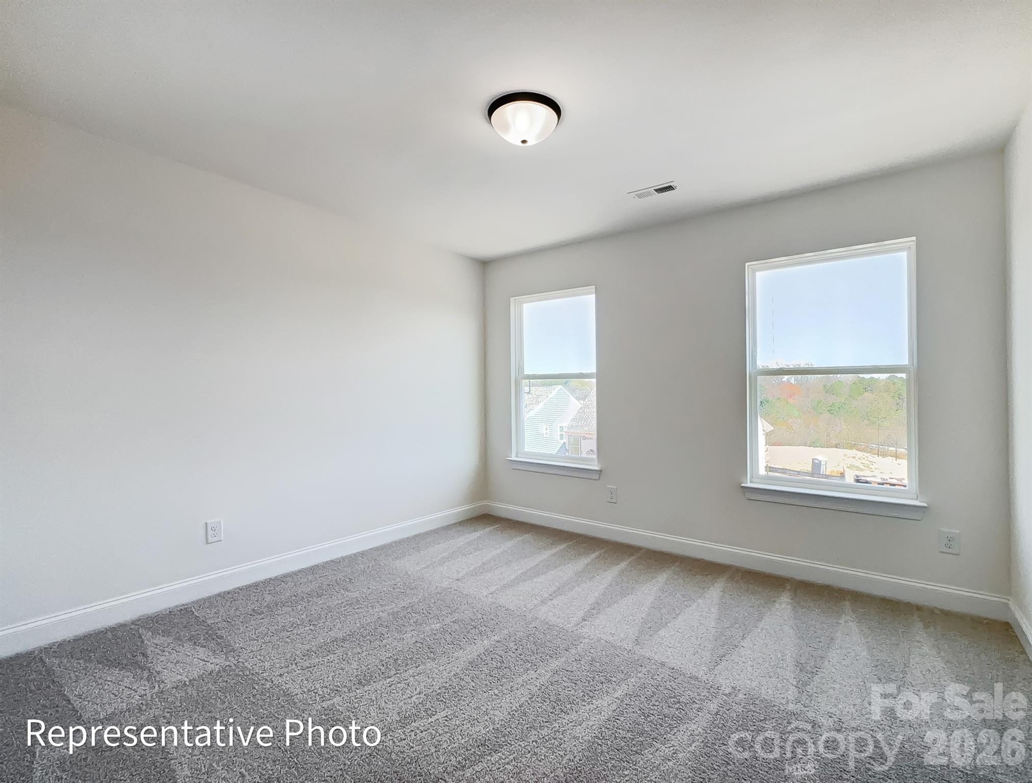 2608 Wild Azalea Court Monroe, NC 28110 - Photo 23 of 26 an empty room with a window