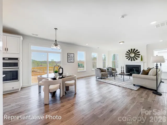 a living room with furniture and a table