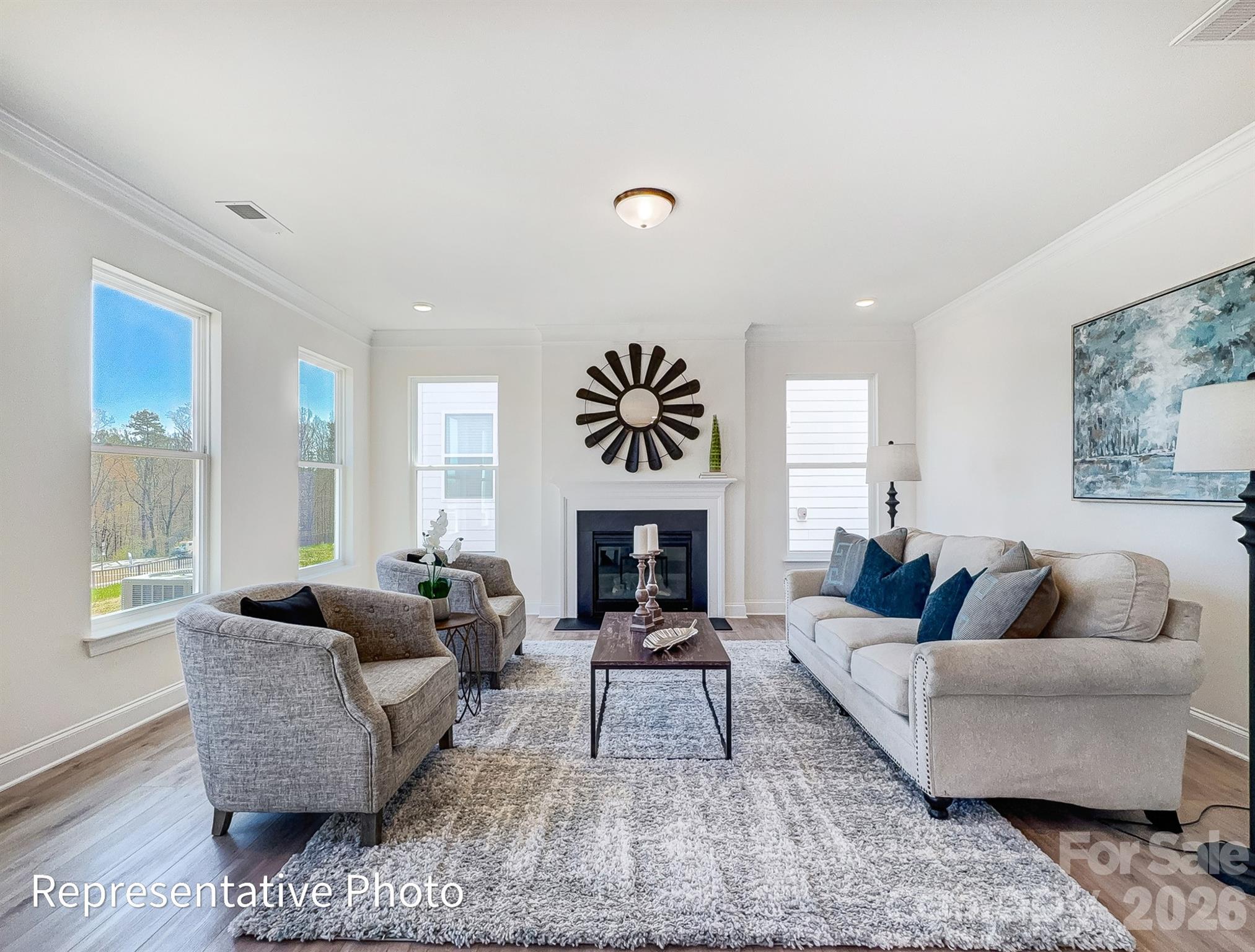 2608 Wild Azalea Court Monroe, NC 28110 - Photo 4 of 26 a living room with furniture and a fireplace