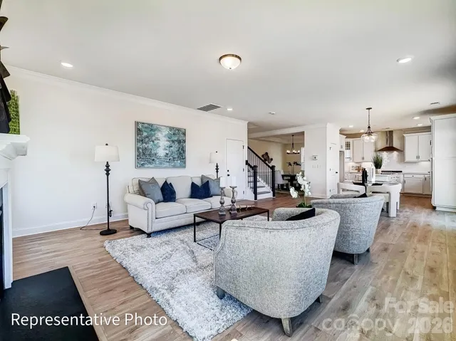 a living room with furniture and a rug