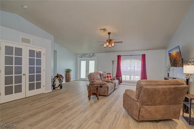 a living room with furniture and a window
