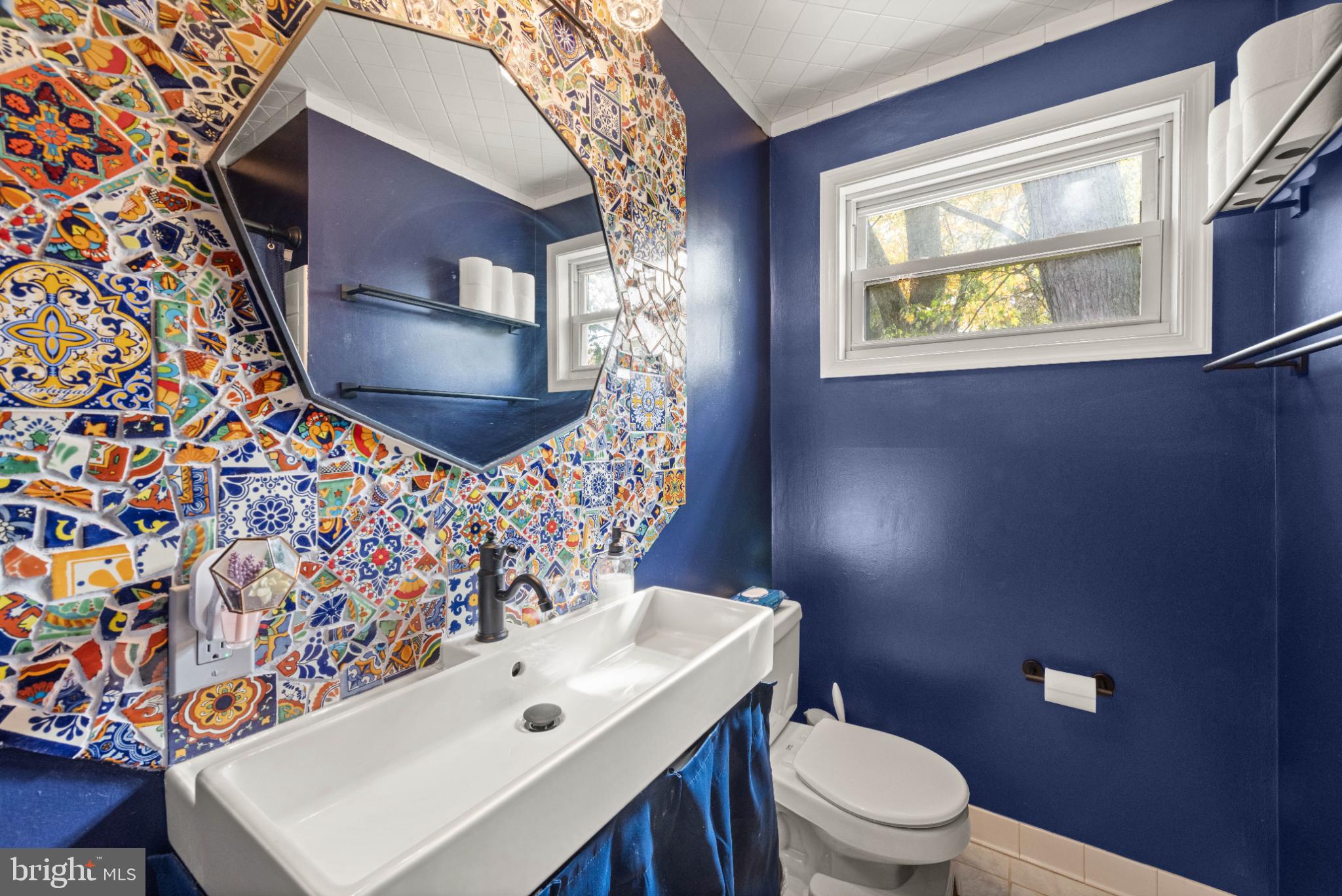 3700 Ralph Road Silver Spring, MD 20906 - Photo 21 of 30 Vibrant tiles enhance a chic bathroom retreat.