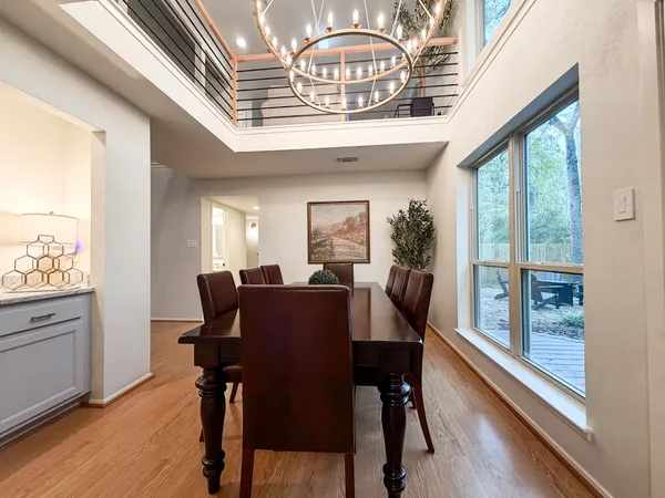 a view of a dining room with furniture window and wooden floor